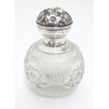 A cut glass perfume bottle with silver lid hallmarked Birmingham 1913 maker Boots Pure Drug Co. 3