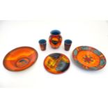 Six items of 20thC Poole Pottery, to include vase, plates etc. with a stylised orange and blue