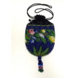 An early 20thC bead work drawstring bag / purse with floral and foliate decoration. Approx. 7 1/2"