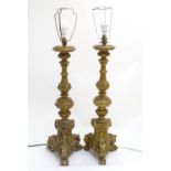 A pair of rococo style table lamps, constructed of carved wood and plaster with gilt finish, 39"