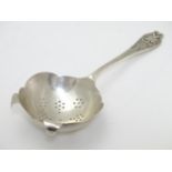 A silver tea strainer hallmarked Sheffield 1961 maker Viners Ltd. 6" long Please Note - we do not