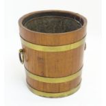 An early 20thC coopered small coal barrel / bucket with removable liner, brass banding and loop