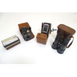 Two Kodak cameras, a Six-20 Brownie C and a Duaflex II. Together with a pair of Chevalier Paris