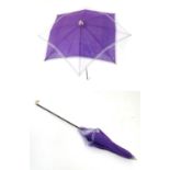 A Victorian parasol with bone handle and tip. Approx. 27 3/4" Please Note - we do not make reference