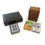 Toys: An early 20thC pokerwork double card box with floral decoration, containing a pack of Club