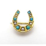 A late 19thC / early 20thC gold sweetheart brooch of horseshoe form set with turquoise and seed