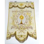 A 20thC religious embroidered wall hanging depicting an ecclesiastical vessel, with wheat sheaf