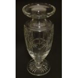A late 19thC cut crystal glass vase, formed as a campagna / urn, decorated with fluted and floral