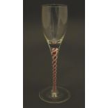A 20thC wine glass with coloured air twist stem, 9 1/2" tall Please Note - we do not make