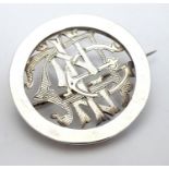 A silver brooch of circular form with monograme to centre 1 1/" diameter Please Note - we do not