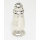 A silver pepper pot, hallmarked Birmingham 1935 maker J B Chatterley & Sons Ltd. 3" high Please Note