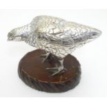 A cast silver plate model of a hen / chicken mounted on a wooden base. The whole 5" high Please Note