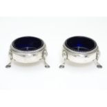 A pair of Victorian silver table salts with blue glass liners. Hallmarked London 1878 maker Richards