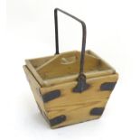A housekeeper's bucket with lift-out tray, constructed of pine with metal corner brackets and