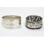 A silver napkin ring hallmarked Birmingham 1935 maker S Blanckensee & Son Ltd, together with another