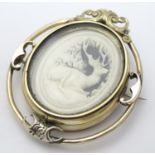 A Victorian mourning brooch / locket the central section with carved stag detail to one side and