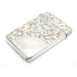 A silver card case with engraved decoration hallmarked 1901 maker Joseph Gloster 3 1/2" x 2 1/4"