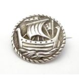 A Scottish silver brooch with Iona style Viking boat decoration to centre hallmarked Glasgow 1950