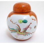 An Oriental ginger jar with hand painted decoration with lobed panels depicting a stylised dragon