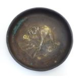 A 20thC brass circular pin dish with embossed decoration depicting an English bulldog on a Union