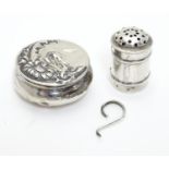 A white metal pot 1 1/2" diameter together with a Victorian silver pepperette (2) Please Note - we