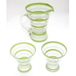 An Art Deco lemonade set, with overpainted green and white banding. Consisting of jug and two