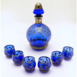 A 19thC blue glass liqueur set, comprising of decanter and six glasses, each decorated with overlaid