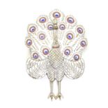 An articulated white metal brooch formed as a peacock with enamel decoration Approx 2 1/4" high