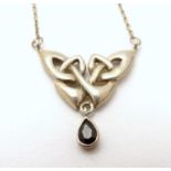 A silver pendant and chain necklace with Celtic style decoration approx 16" long Please Note - we do