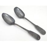 A pair of Irish fiddle pattern table spoons hallmarked Dublin 1824 maker Samuel Neville. 9" long