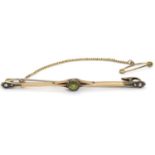 A 9ct gold bar broch set with peridot and seed pearls 2 1/2" long Please Note - we do not make