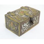 A Persian cedar lined brass spice box of casket form, with inlaid white metal and copper