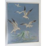 A 20thC embroidery depicting seagulls in flight over a crashing wave. Approx. 15 1/4" x 12 1/4"