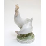 A Royal Copenhagen model of two cockerels / chickens. Marked under. Approx. 10 1/4" high Please Note