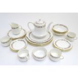 A quantity of Royal Albert tea wares in the pattern Belinda, comprising teapot, milk jug, sugar,
