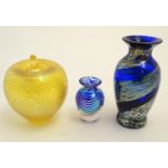 Three items of art glass, comprising a paperweight formed as an apple, and two vases. The largest
