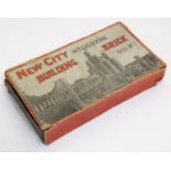 Toy: An early 20thC boxed wooden building blocks game, New City Interlocking Building Bricks, no