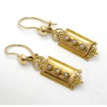 A pair of gold drop earrings set with seed pearls (unmarked - tests as 18ct) Approx 1" long Please