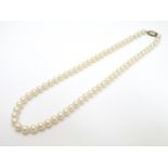A pearl necklace set with silver gilt clasp 18" long Please Note - we do not make reference to the