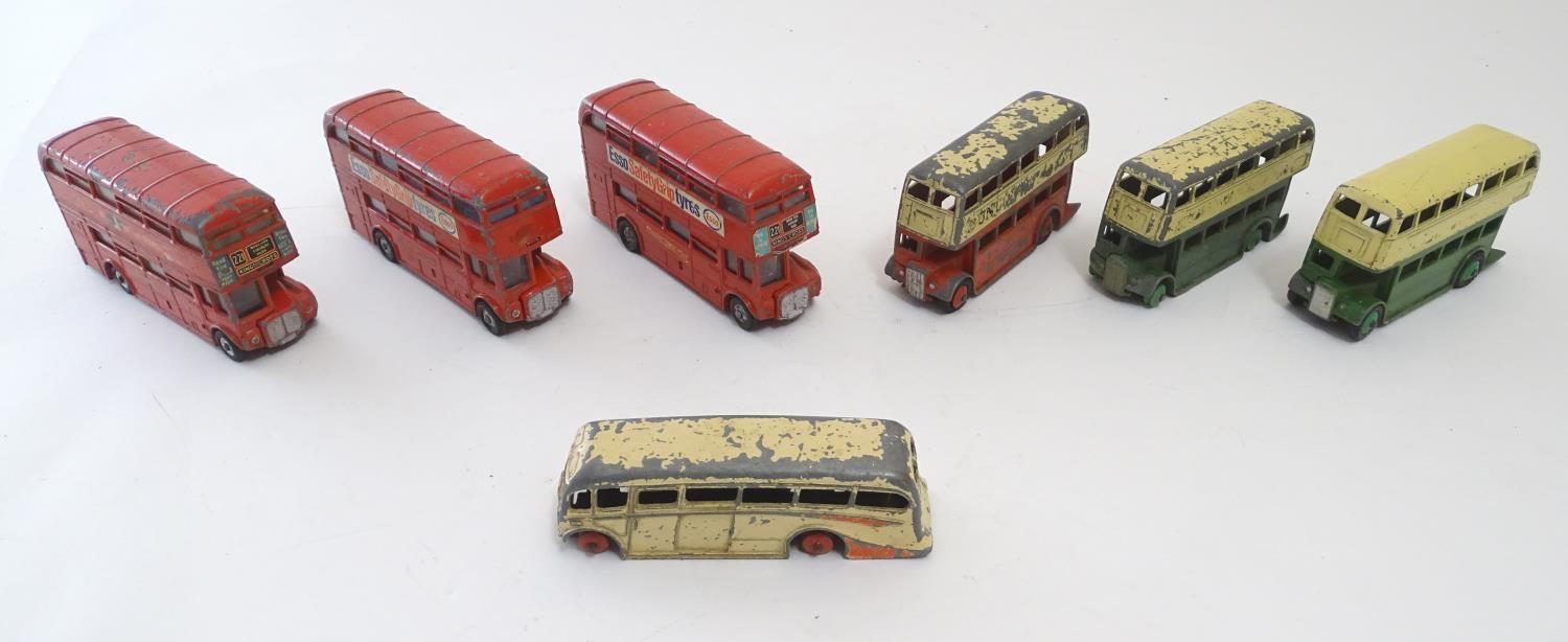 Toys: Seven Dinky Toys die cast scale model buses, comprising a Double Decker Bus, cream and red