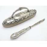 A silver mounted nail buffer with embossed angel detail hallmarked Birmingham 1902 maker Adie Bros