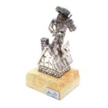 A 925 silver model of a fiddler on a roof mounted on a marble base. Base bears a plaque entitled ?