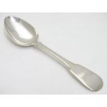 A Geo III Scottish silver fiddle pattern dessert spoon. Hallmarked Edinburgh 1817 maker Alexander