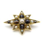 A yellow metal brooch of star form set with banded agate, rose-cut diamonds and half pearls. 1 1/