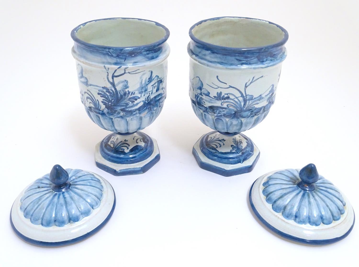 A pair of Continental blue and white pedestal jars and covers decorated with hand painted - Image 4 of 6