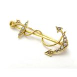A 15ct gold brooch formed as an anchor and set with seed pearls. 1 1/4" high Please Note - we do not