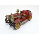 Toys: A Schuco tinplate clockwork car, Mercer, model no. 1225. Approx. 3" x 7" Please Note - we do