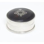 A round silver box with domed tortoiseshell top with piquet work detail to lid. Hallmarked London