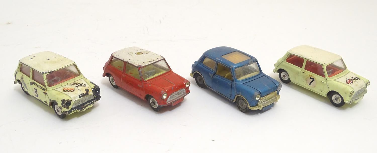 Toys: Four Corgi Toys die cast scale model cars comprising BMC Mini Cooper S with a blue body and