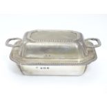 A small silver butter dish and cover Hallmarked Birmingham 1913 maker Adie Bros Ltd. 4 1/4" wide